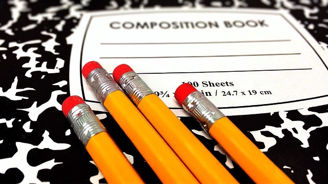 Composition book with pencils