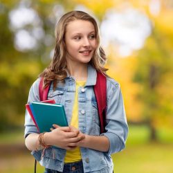 Autumn Girl Smiling With Journal In The Fall