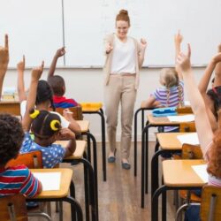 Female Teacher Interacting With Students