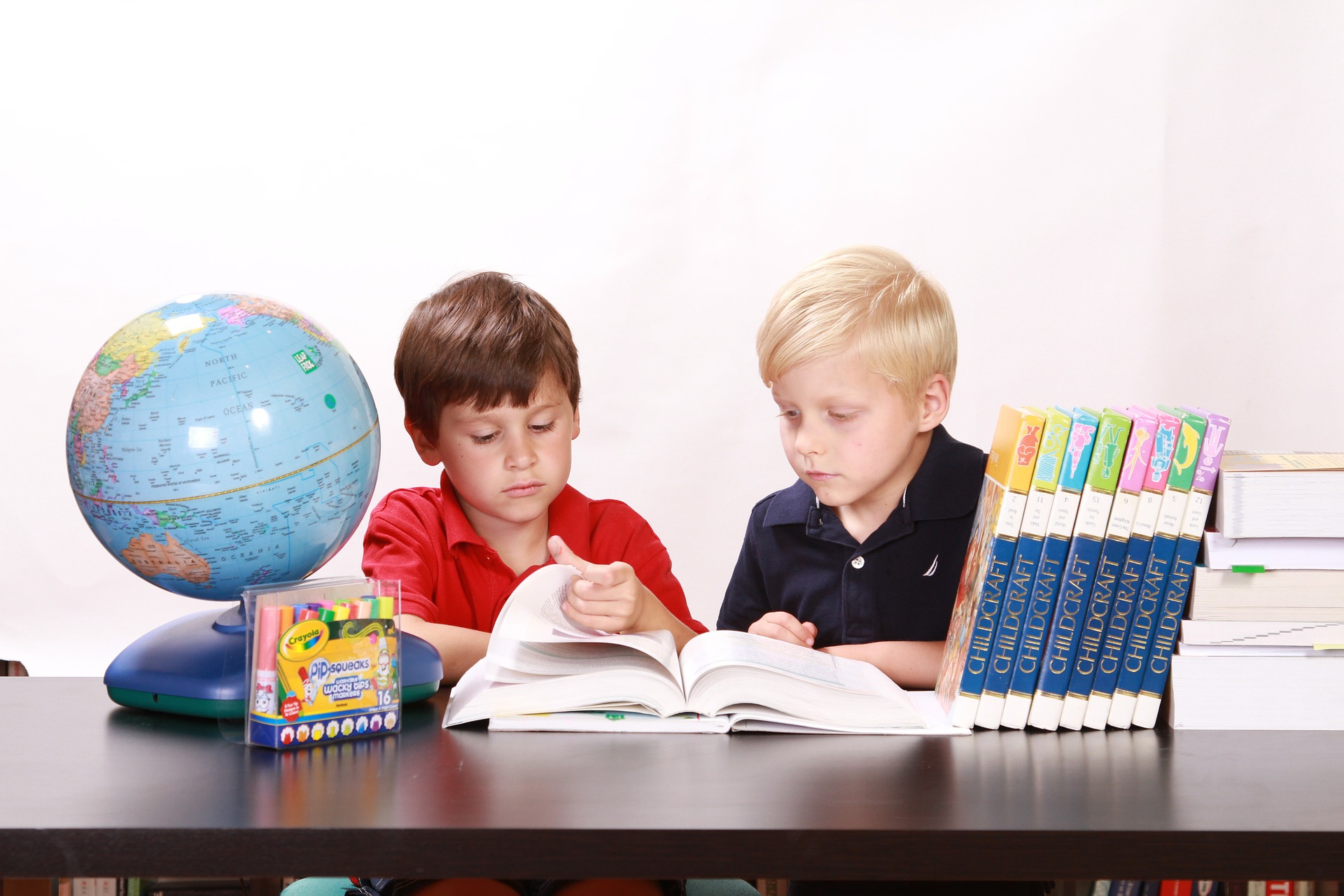 Two boys doing school work