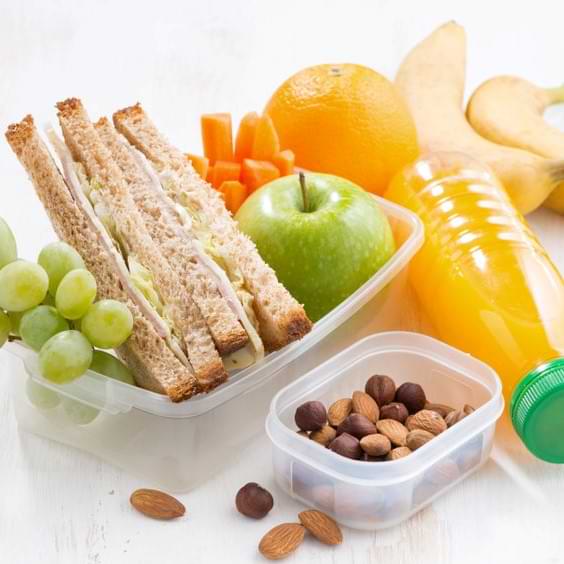 Sandwich C Fruit C And Almonds On White Table