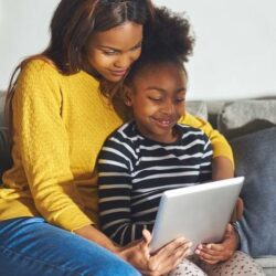 African American Mother And Child With Tablet Smiling
