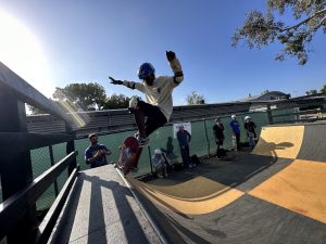 Parkway Academy 7th grader Jeremiah breaks in the new skate ramp with a display of skill honed in the school's Skate Club