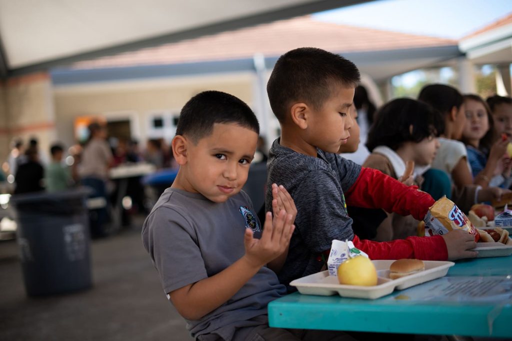 Kid eating at Lunchtable